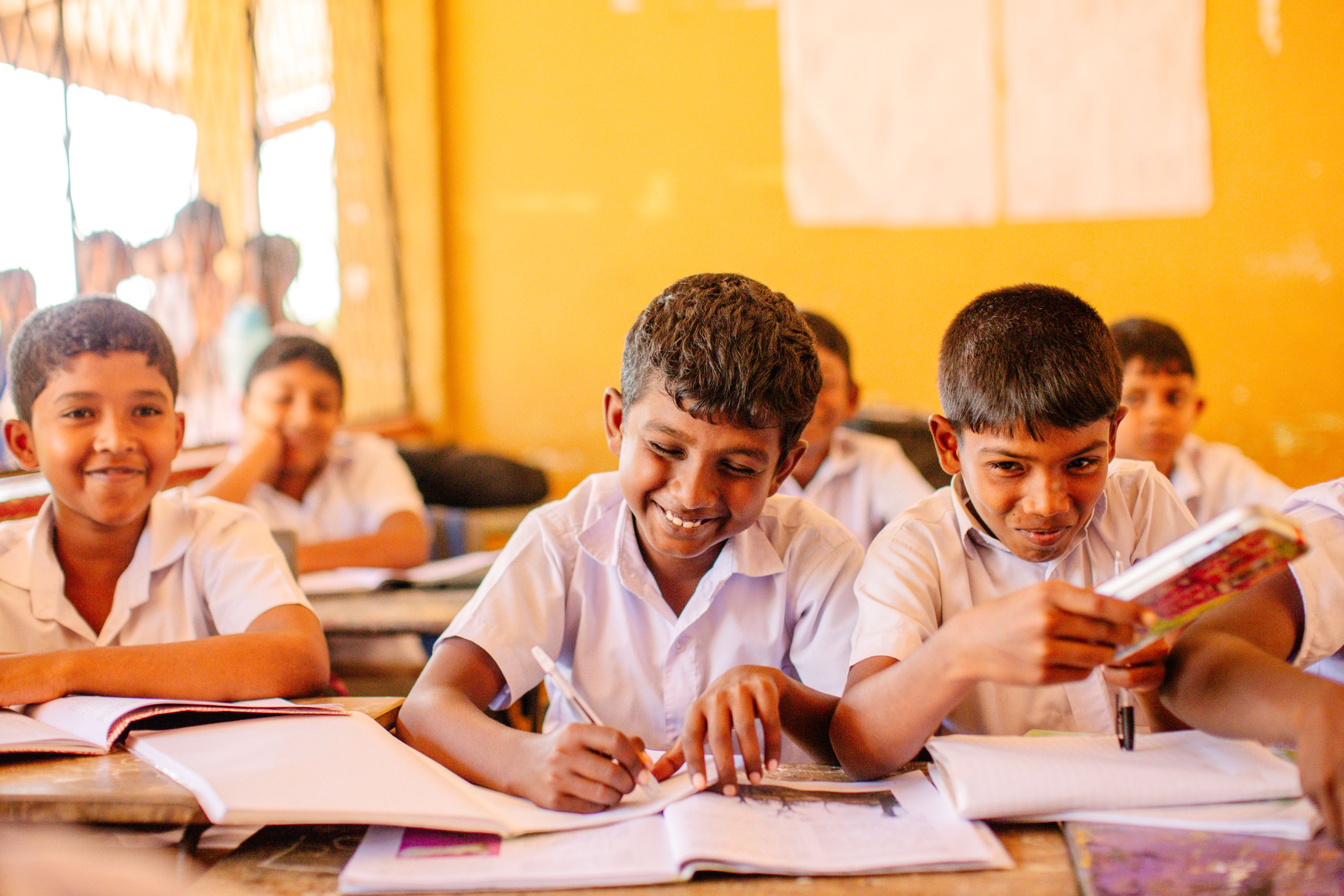 Sponsored school boys smiling in class
