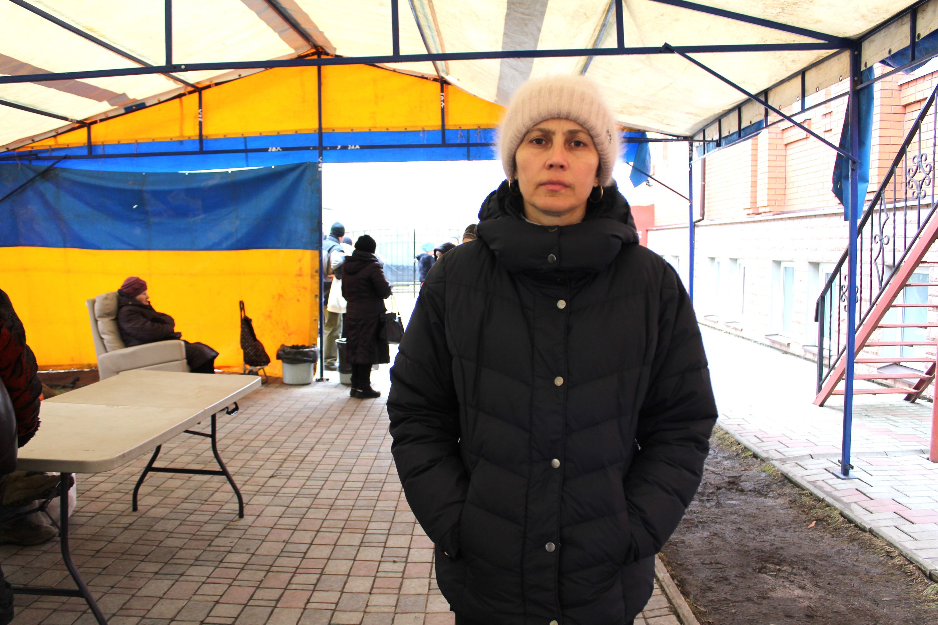 Wrapped up for a cold day, Halyna, 48, arrives to collect hot meals from a mobile kitchen run by World Vision partner Baptist World Aid