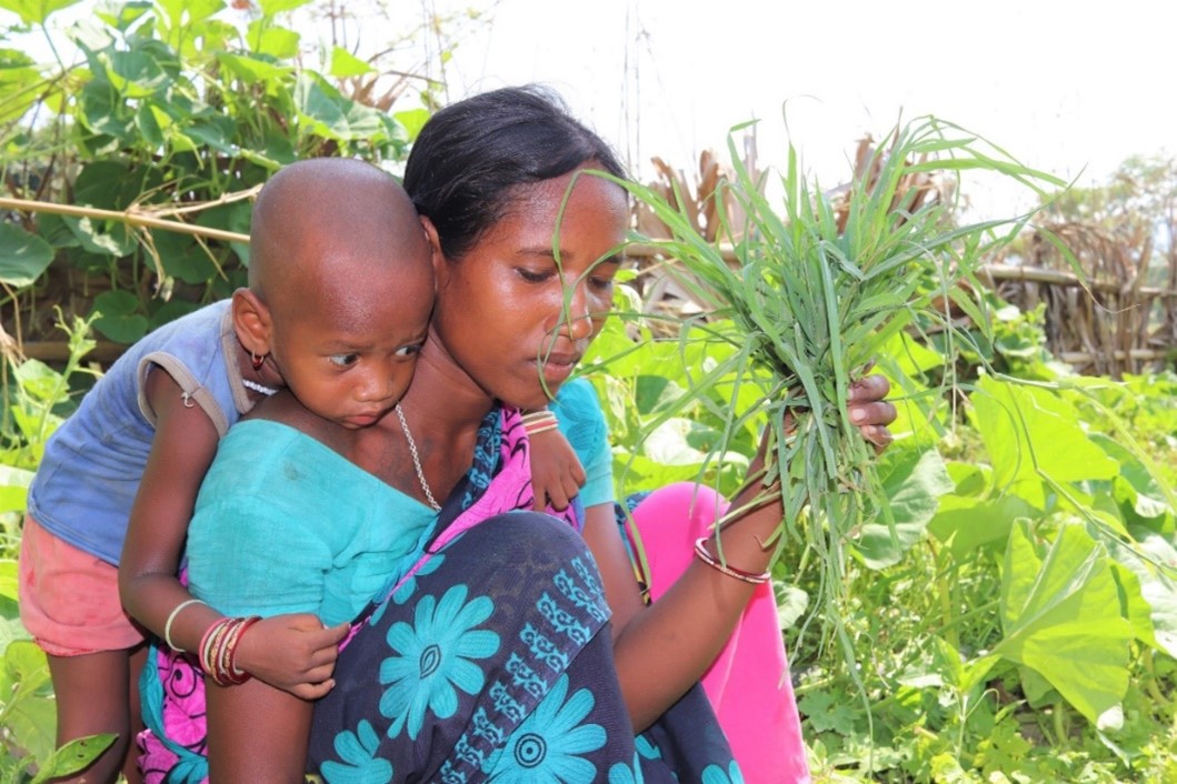 Priya and her mum tend the vegetable garden