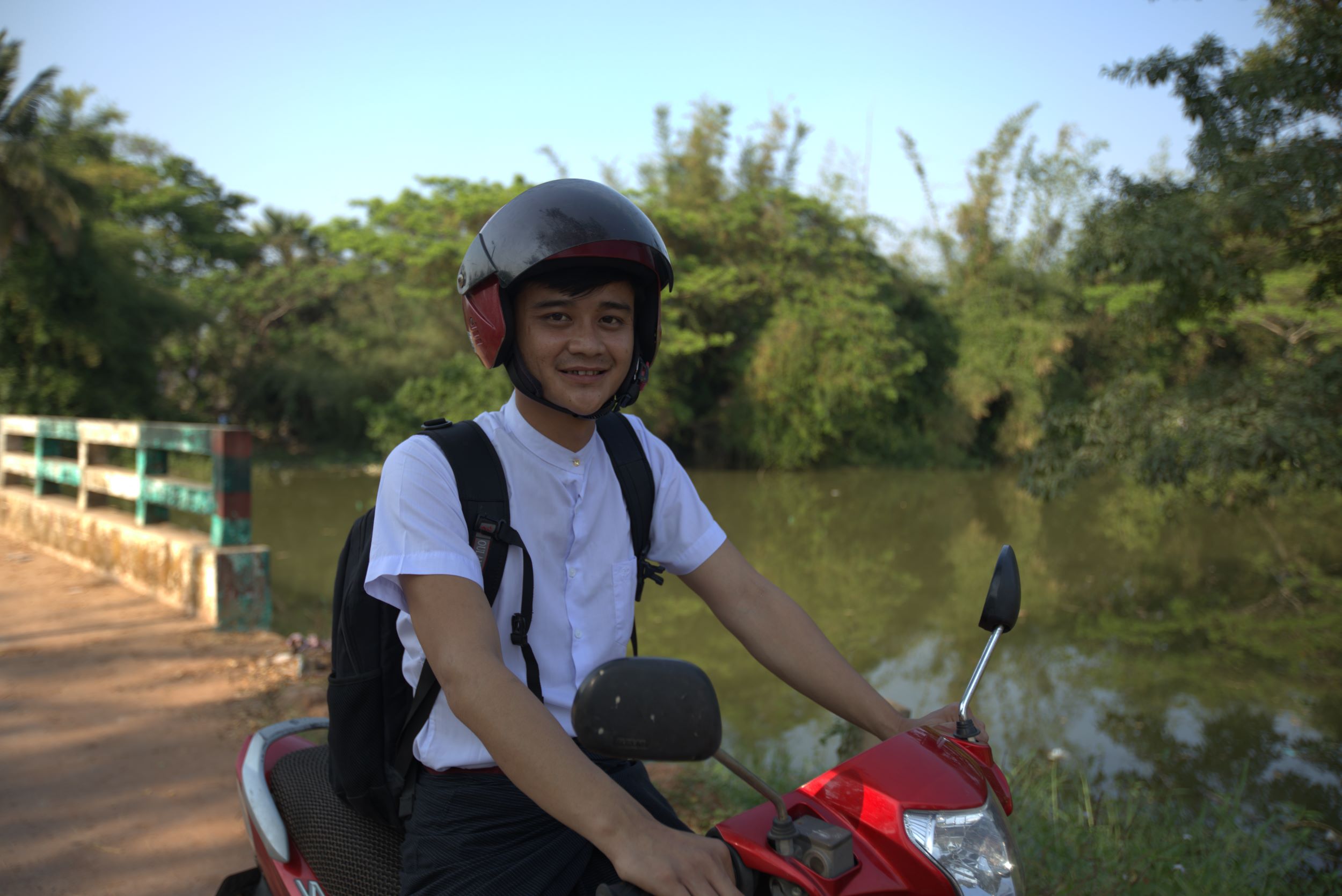 Htoo pictured on his scooter, is now giving back to his community, doing vital nutritional work that will benefit his community for years to come