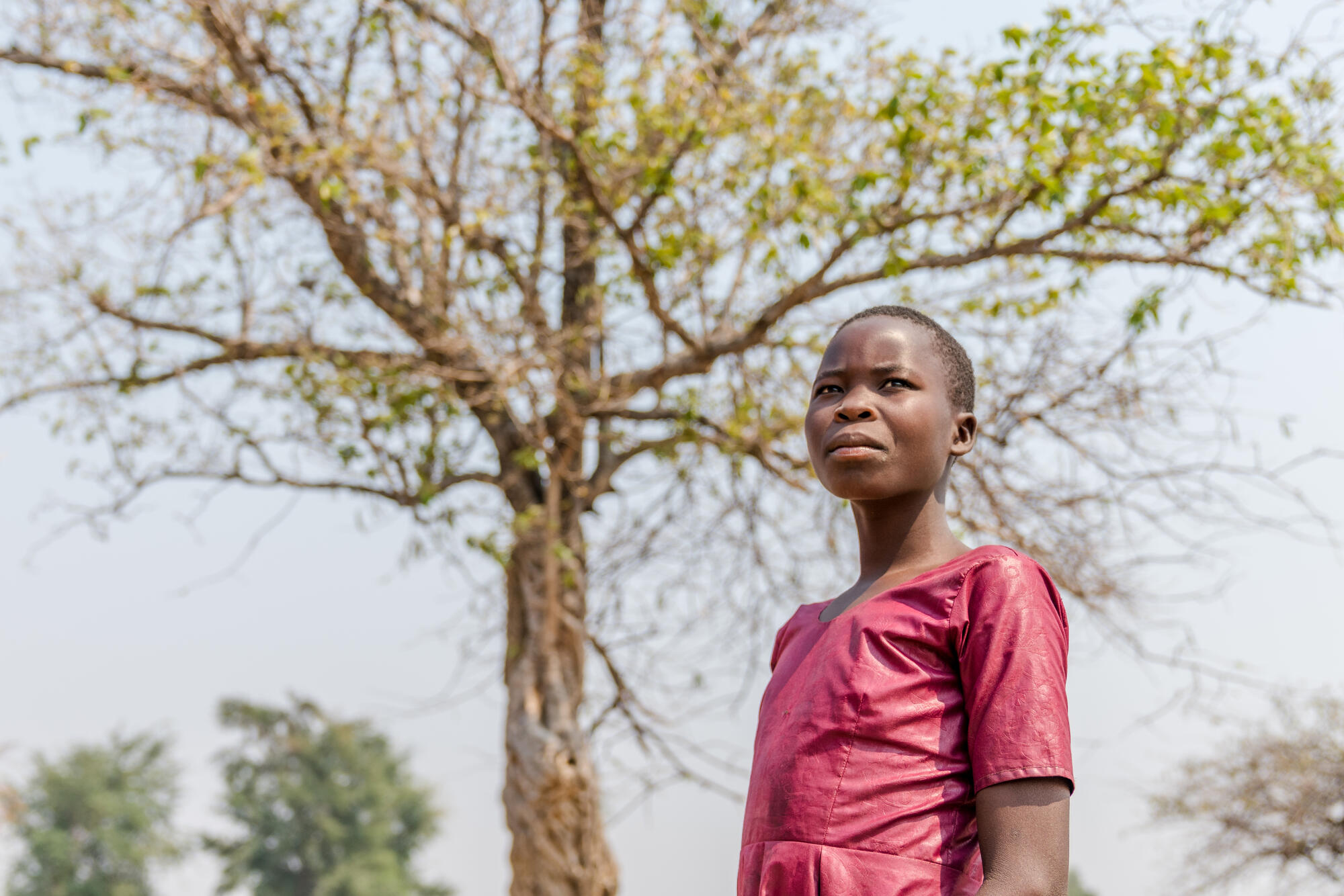A young child in South Sudan, part of a community that is receiving farm management tools and training to boost their crop yield.