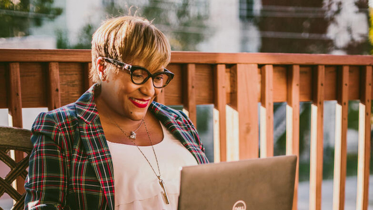 Child sponsor, Renee, looks at her laptop to find out more about her sponsored child Maureen