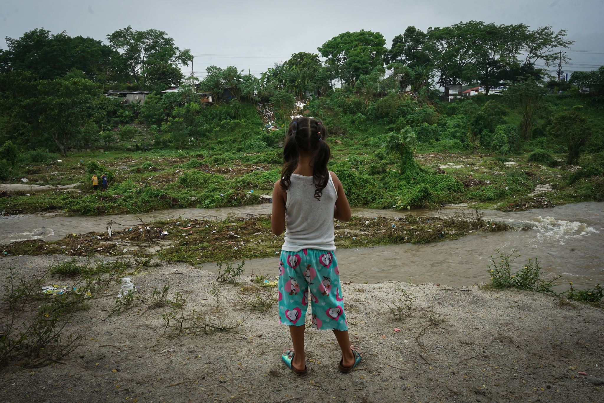 Girl looking at flooding in Honduras