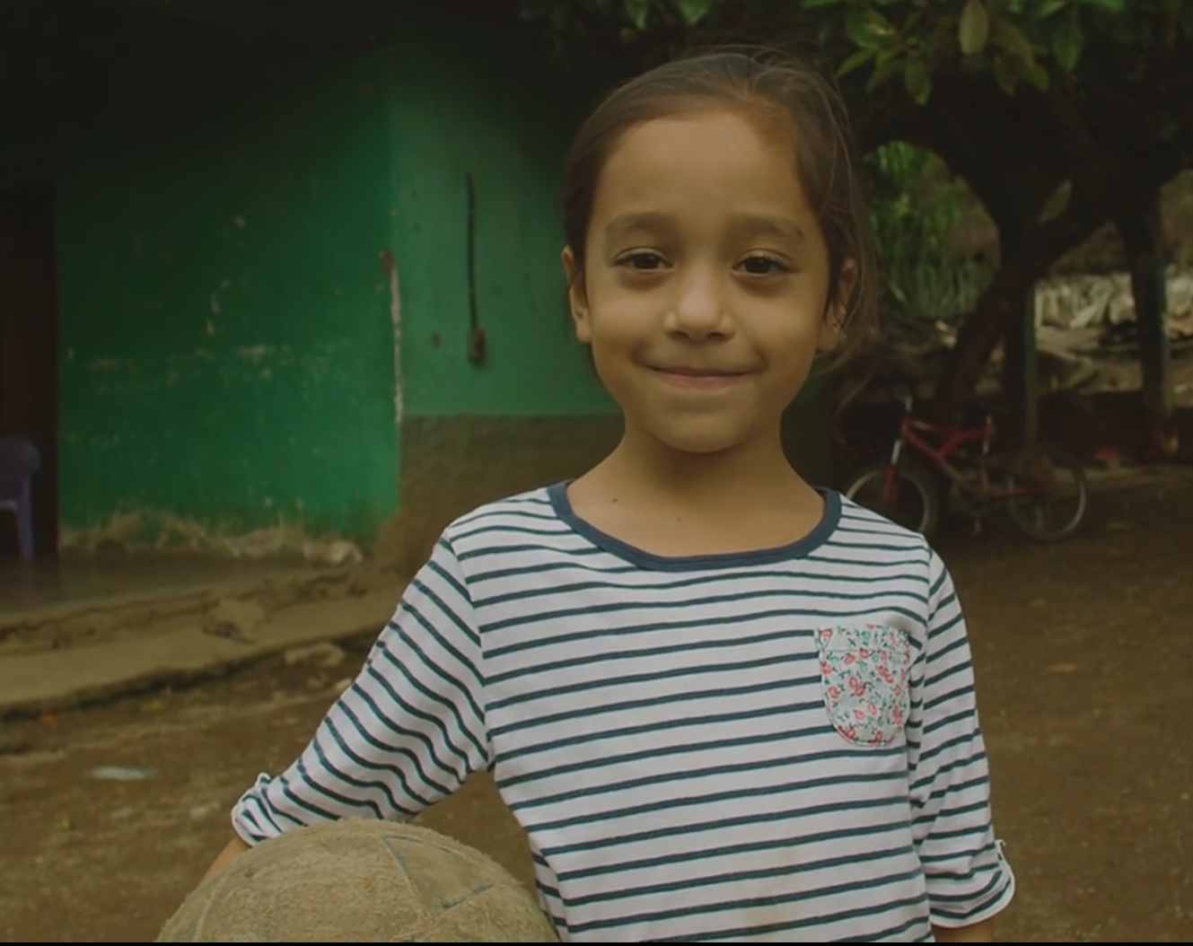 Odalis, 6, smiles at home 