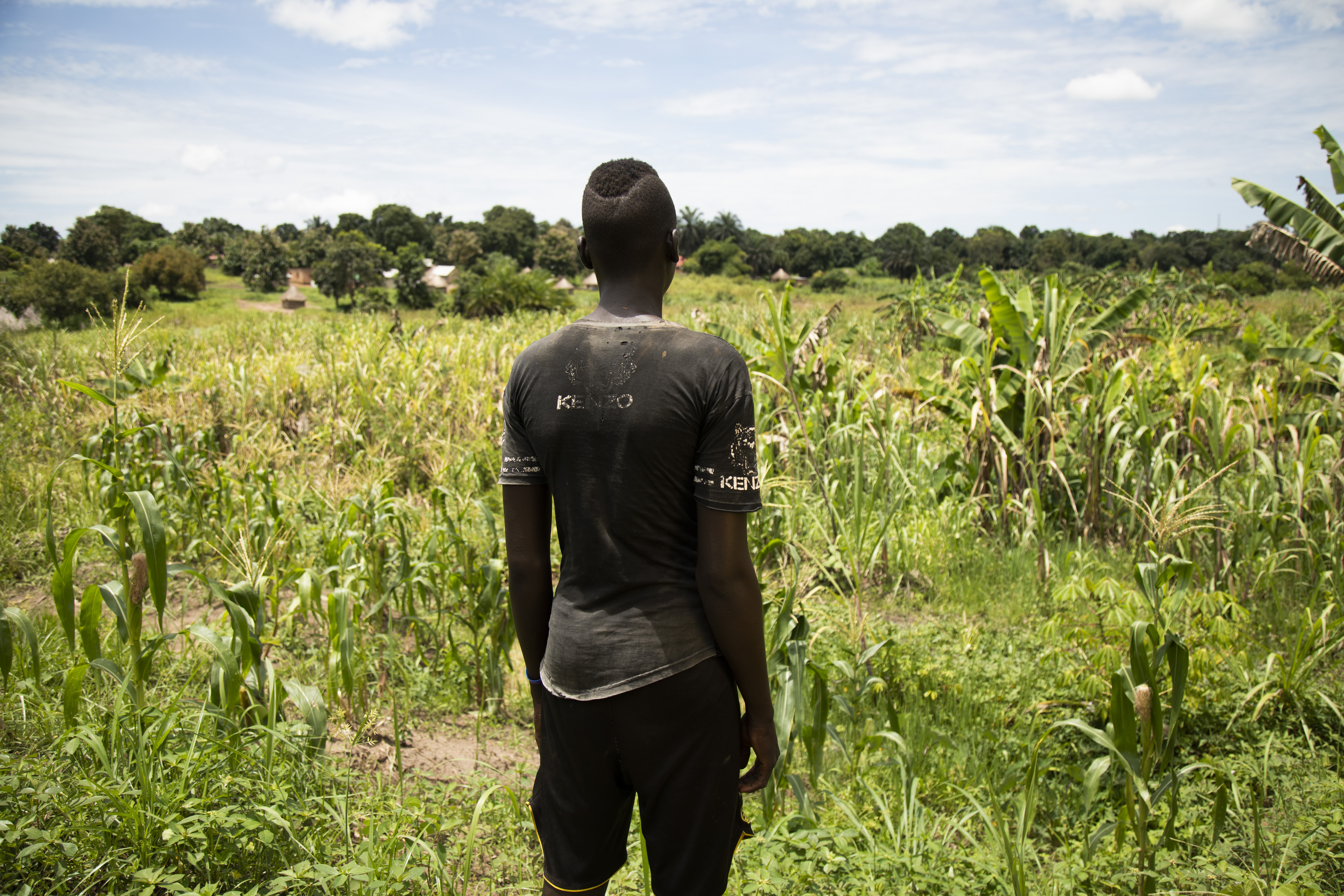 Young man standing in a field
