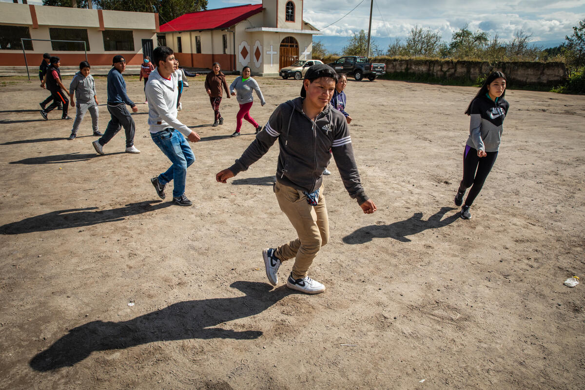 Young people, members of a community dance group in Ecuador, rehearse for an up coming parade.
