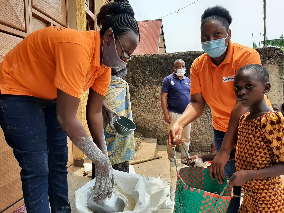 A young girl is fed nutritious food.