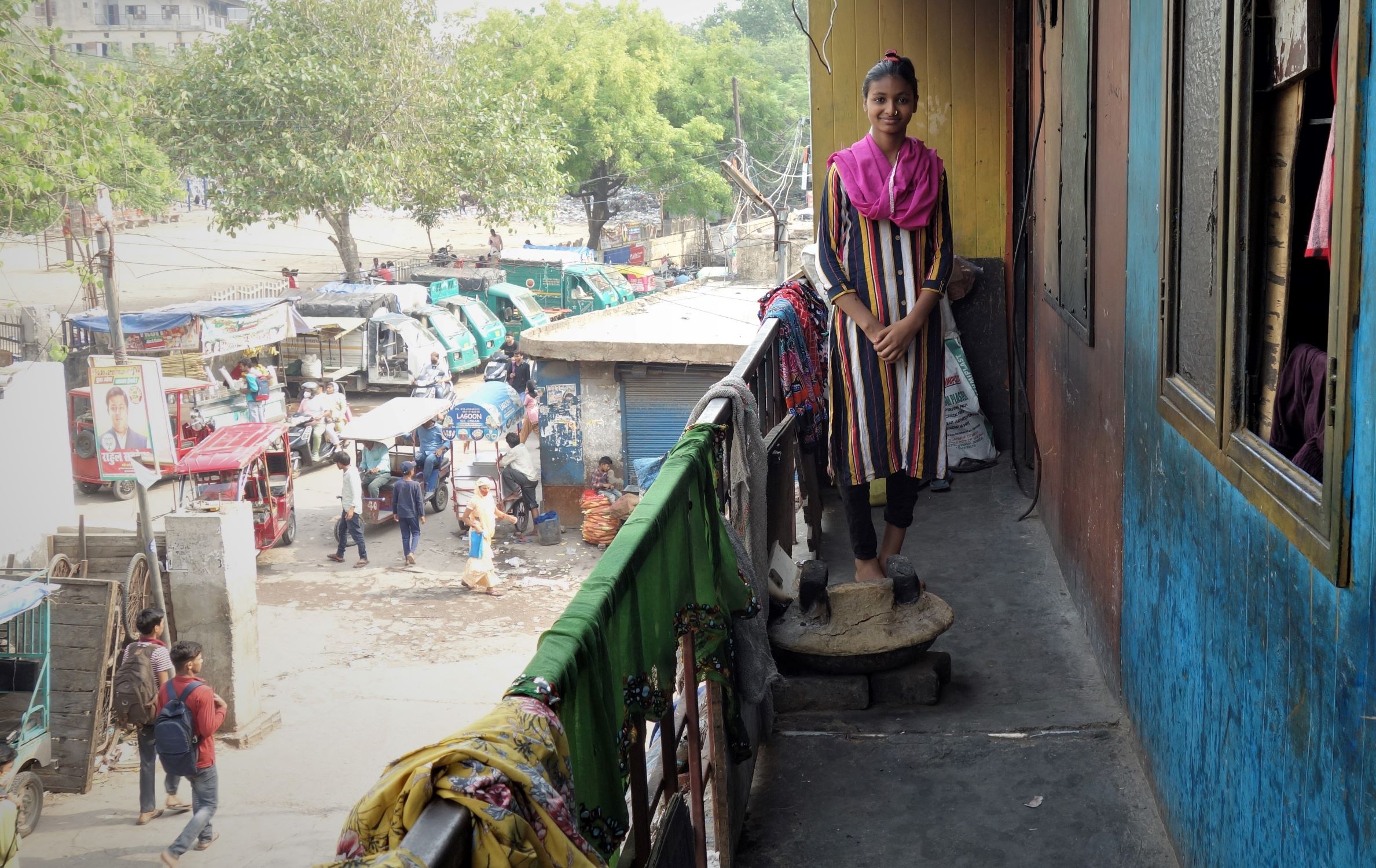 Young lady standing in her rag picking community