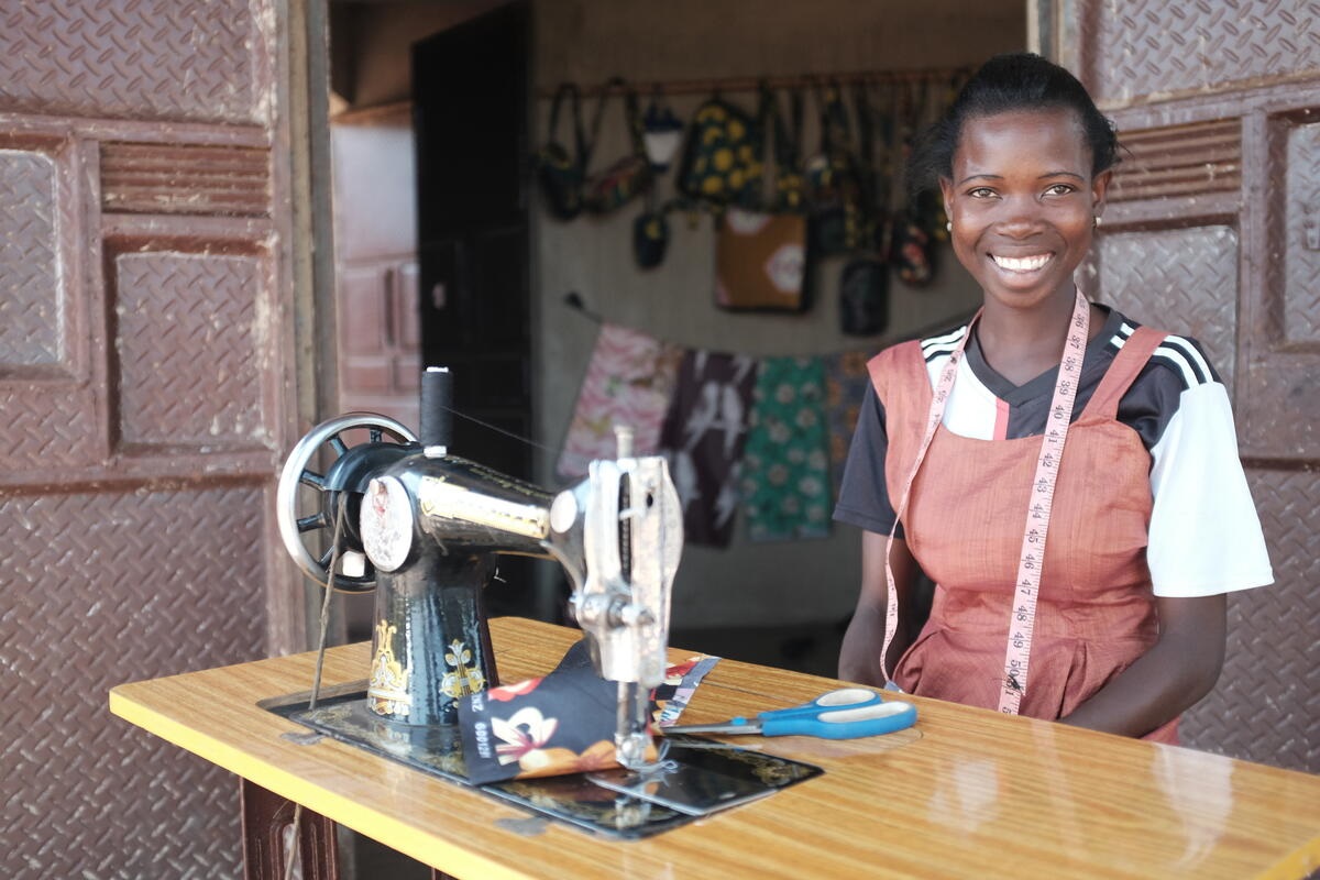 Teenager with sewing machine