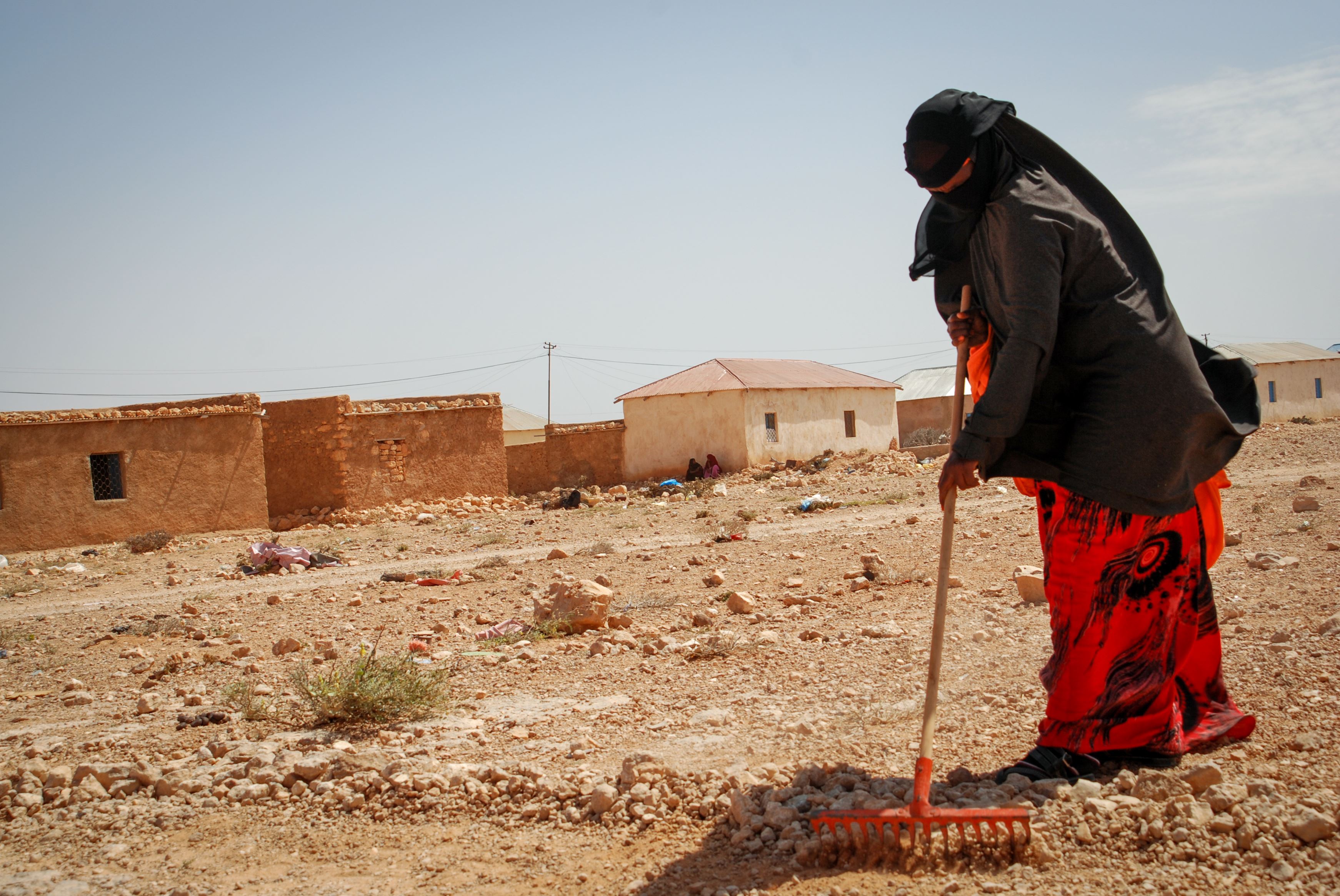 Woman farming in a desert like landscape