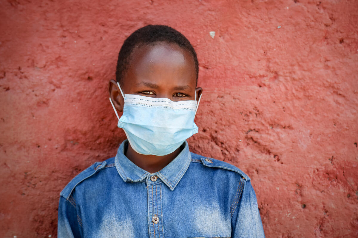 Kenyan boy wears a face mask during covid crisis