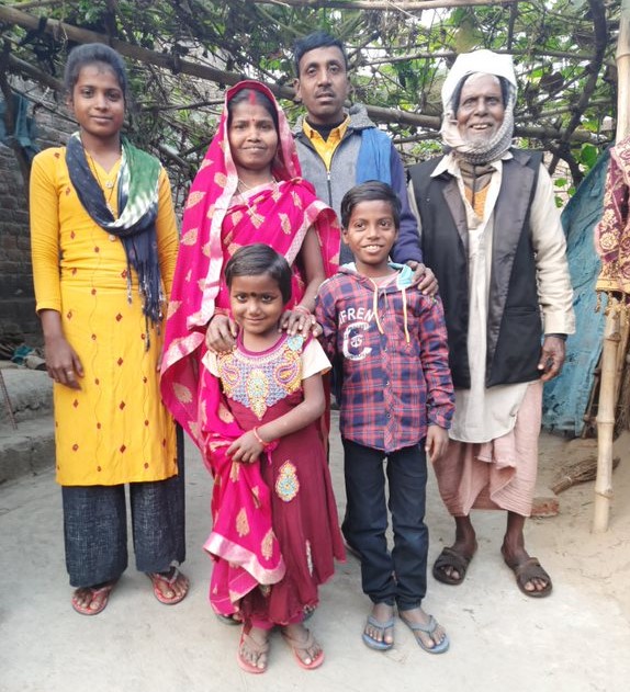 Muna (front, right), now nine, recovered from malnutrition