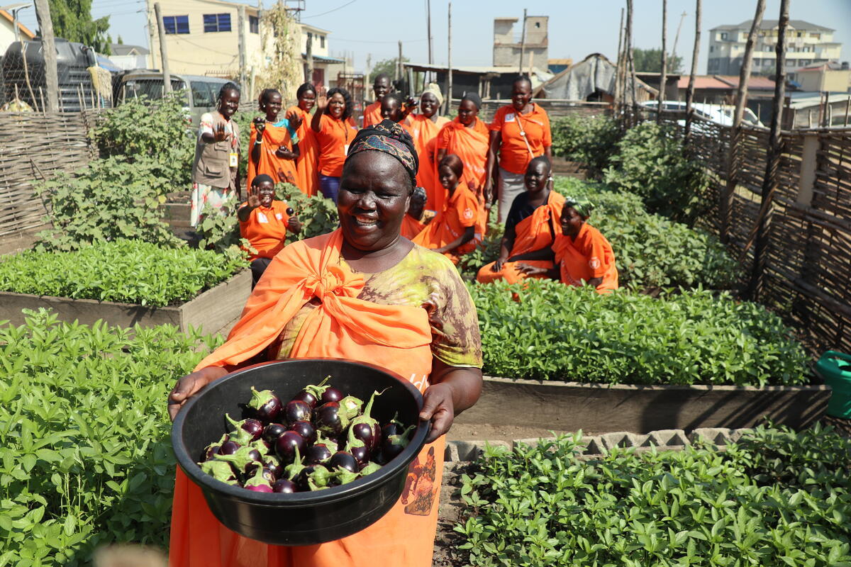 Lady carrying basket of vegetables