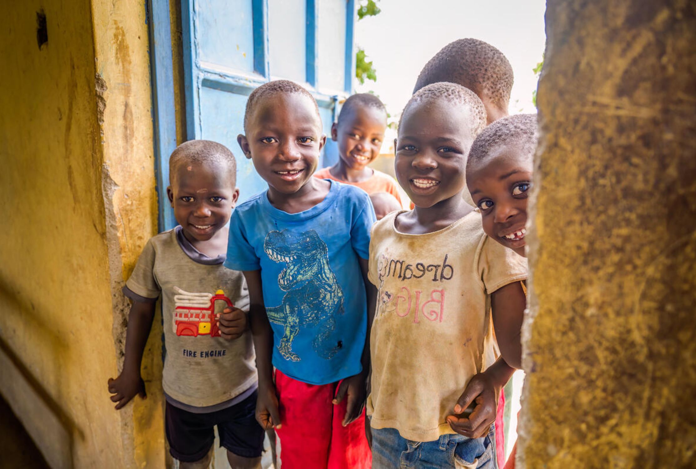 Kenyan children looking into a classroom