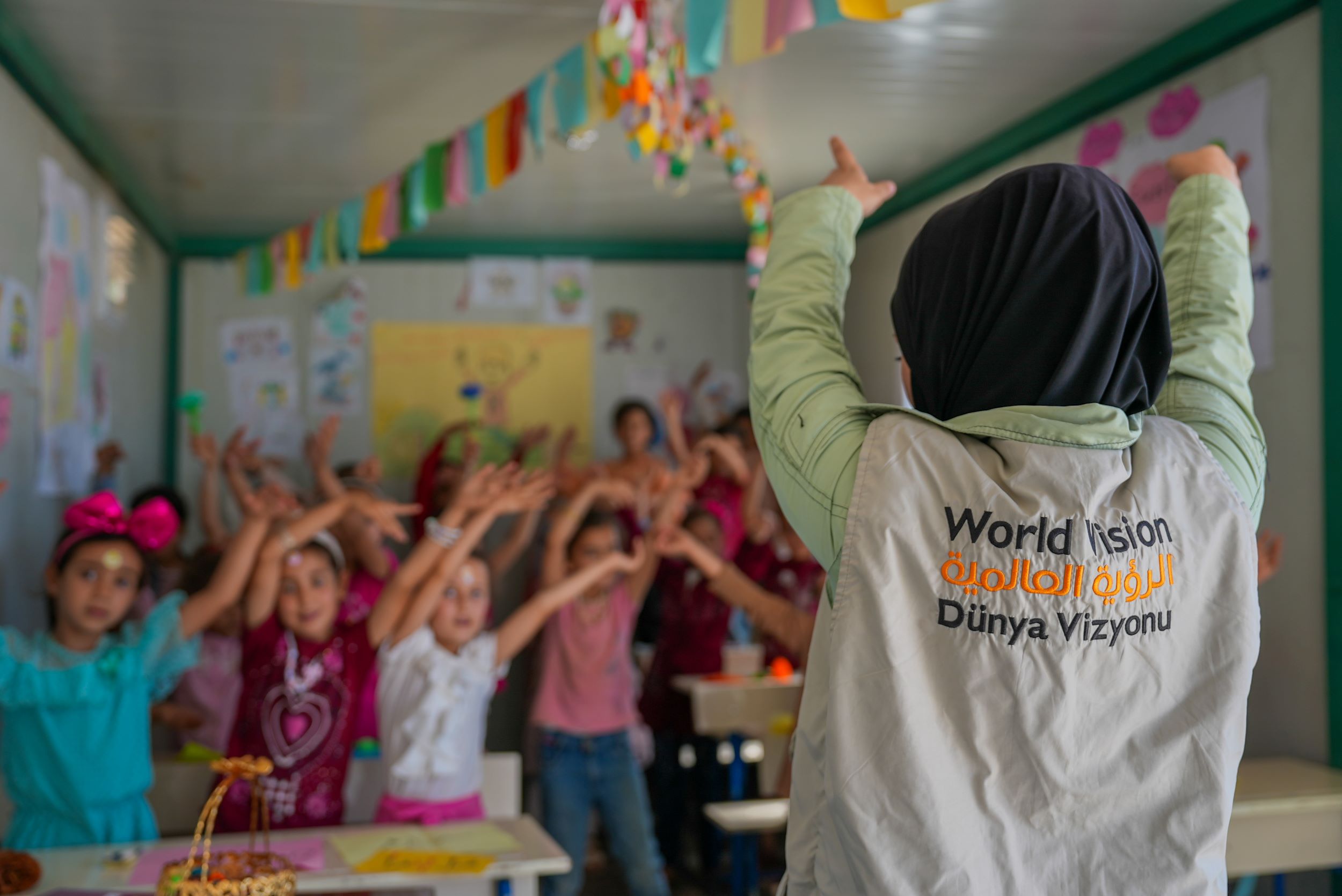 A classroom of girls participating in a World Vision education activity