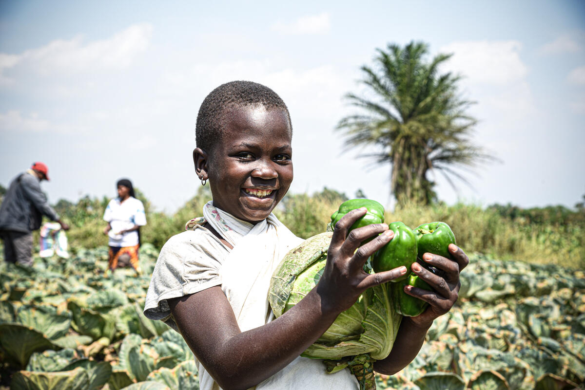 Child holding vegetables