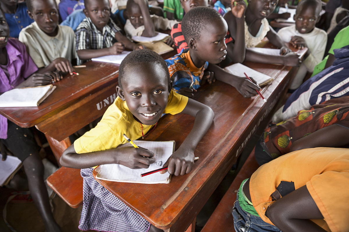 Eight-year old Doruka (yellow t-shirt) and her sister, Sejarina (blue t-shirt), 10 are lively, bright, cheeky, smiling South Sudanese girls who have been living in a refugee settlement in north-west Uganda since September 2017.