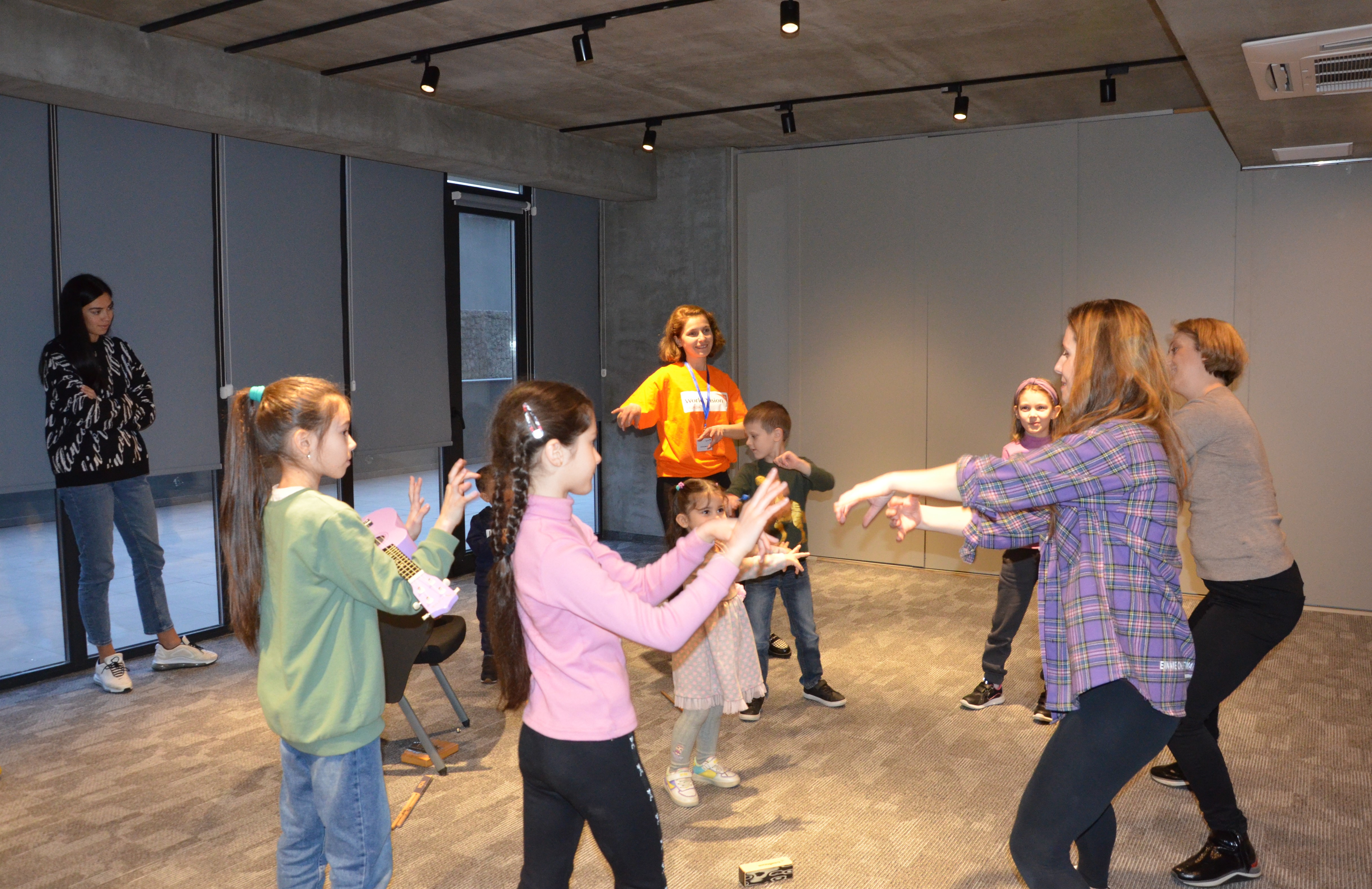 Children dance as part of a creative session with World Vision Georgia