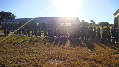 Children in Zambia outside their school